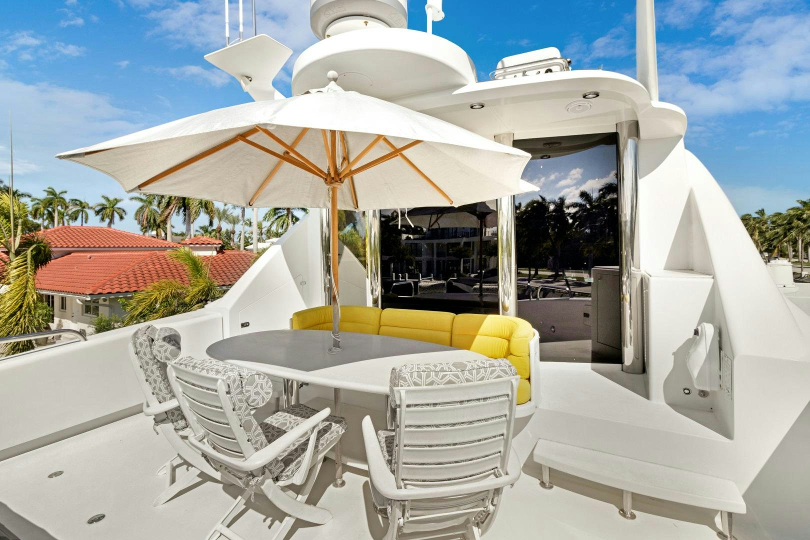 a table and chairs outside of a house aboard SUZANNE Yacht for Sale