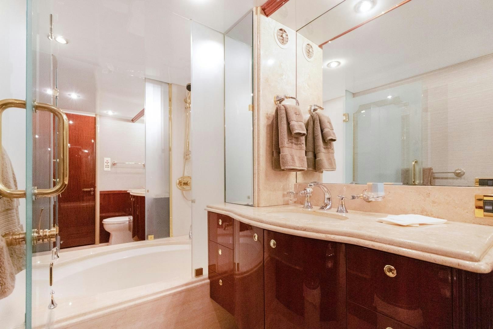 a bathroom with a large mirror aboard SUZANNE Yacht for Sale