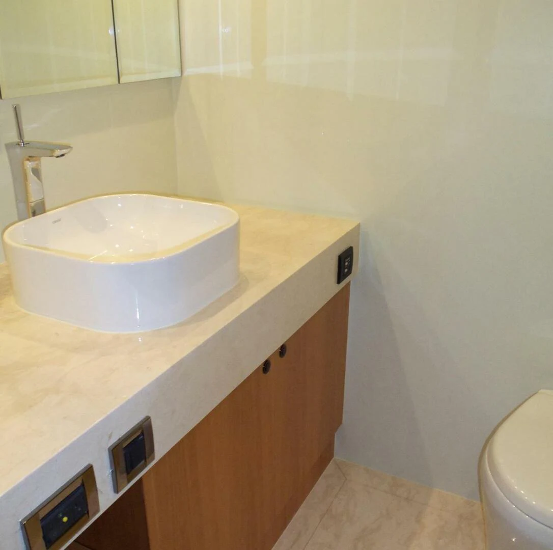 a bathroom with a sink and a toilet aboard JOHNSON 93 OPEN FB Yacht for Sale