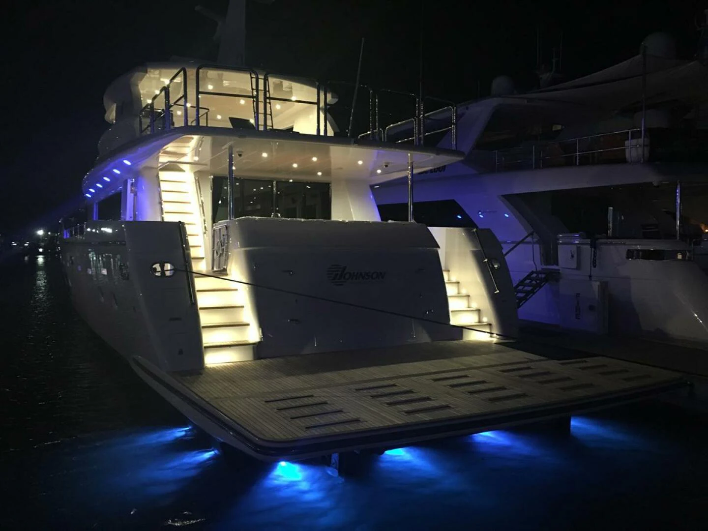 a large ship with lights aboard JOHNSON 93 OPEN FB Yacht for Sale
