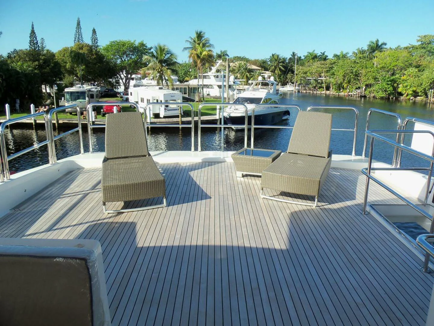 a deck with chairs and tables aboard JOHNSON 93 OPEN FB Yacht for Sale