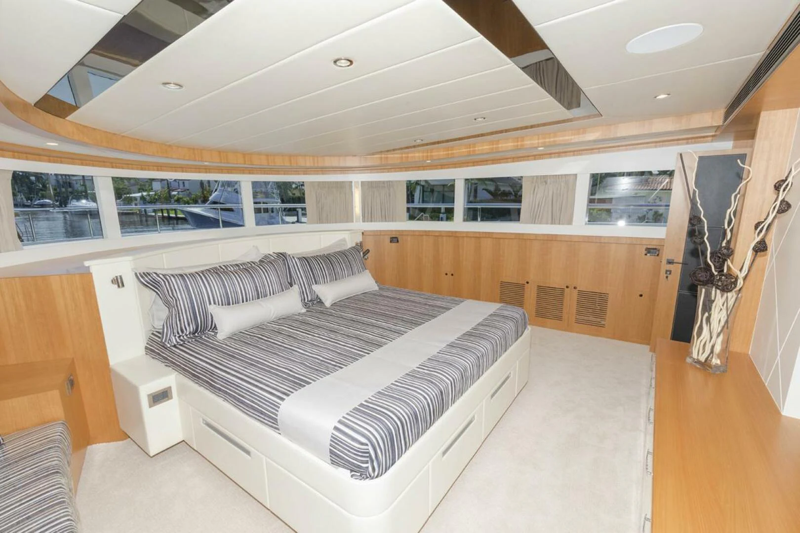 a room with a bed and a large window aboard JOHNSON 93 OPEN FB Yacht for Sale