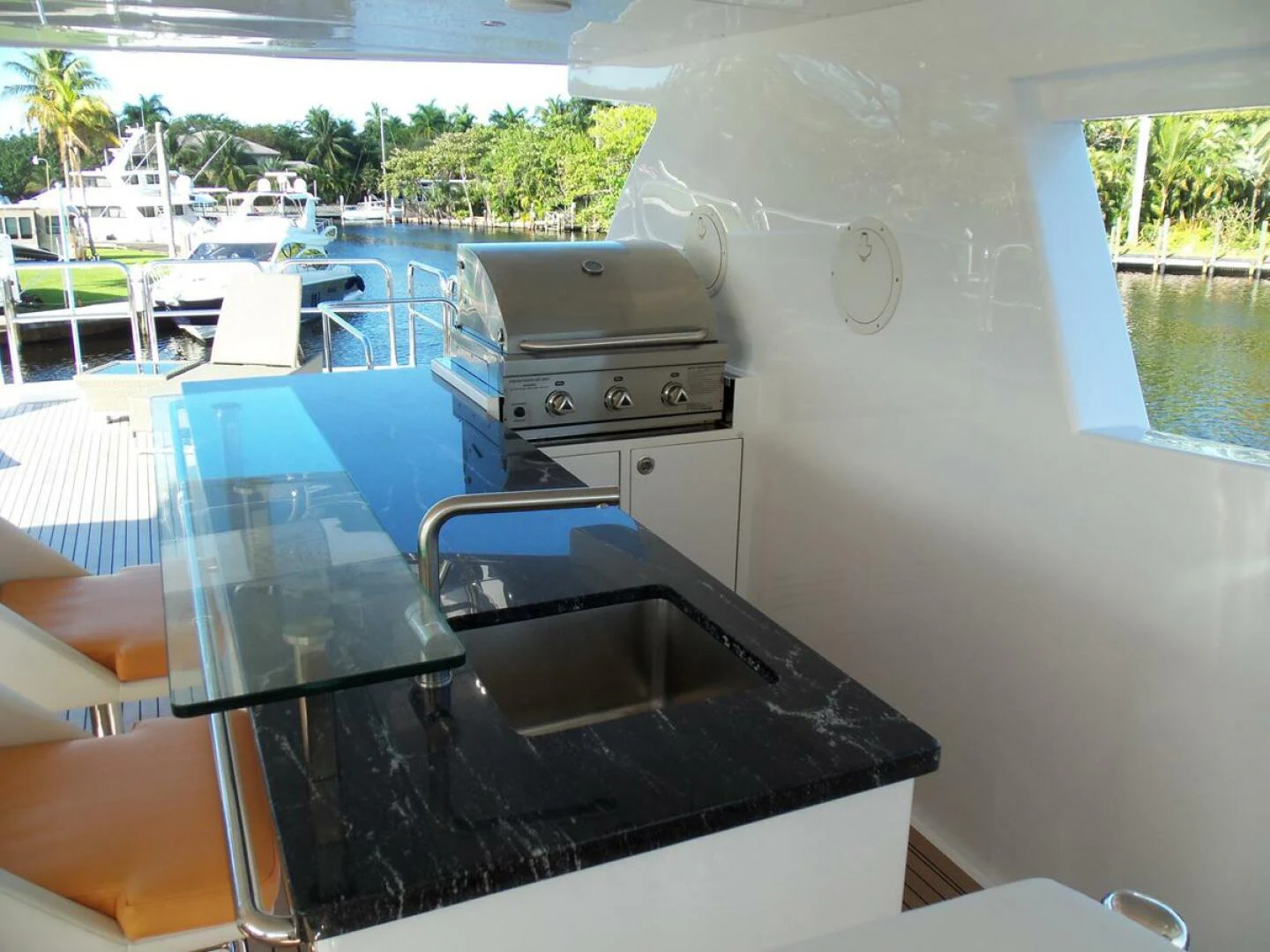 a large boat with a sink aboard JOHNSON 93 OPEN FB Yacht for Sale