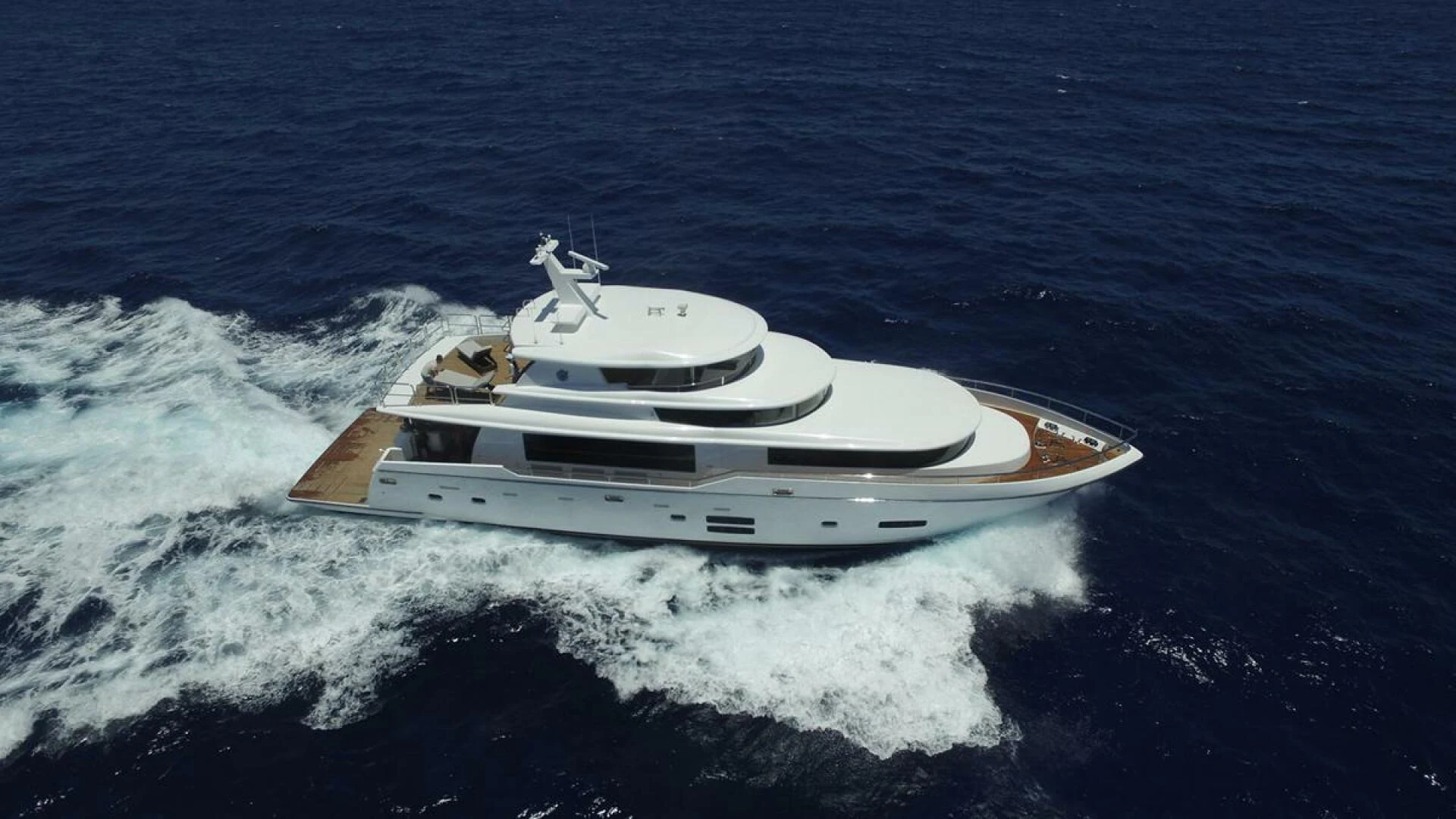 a boat on the water aboard JOHNSON 93 OPEN FB Yacht for Sale