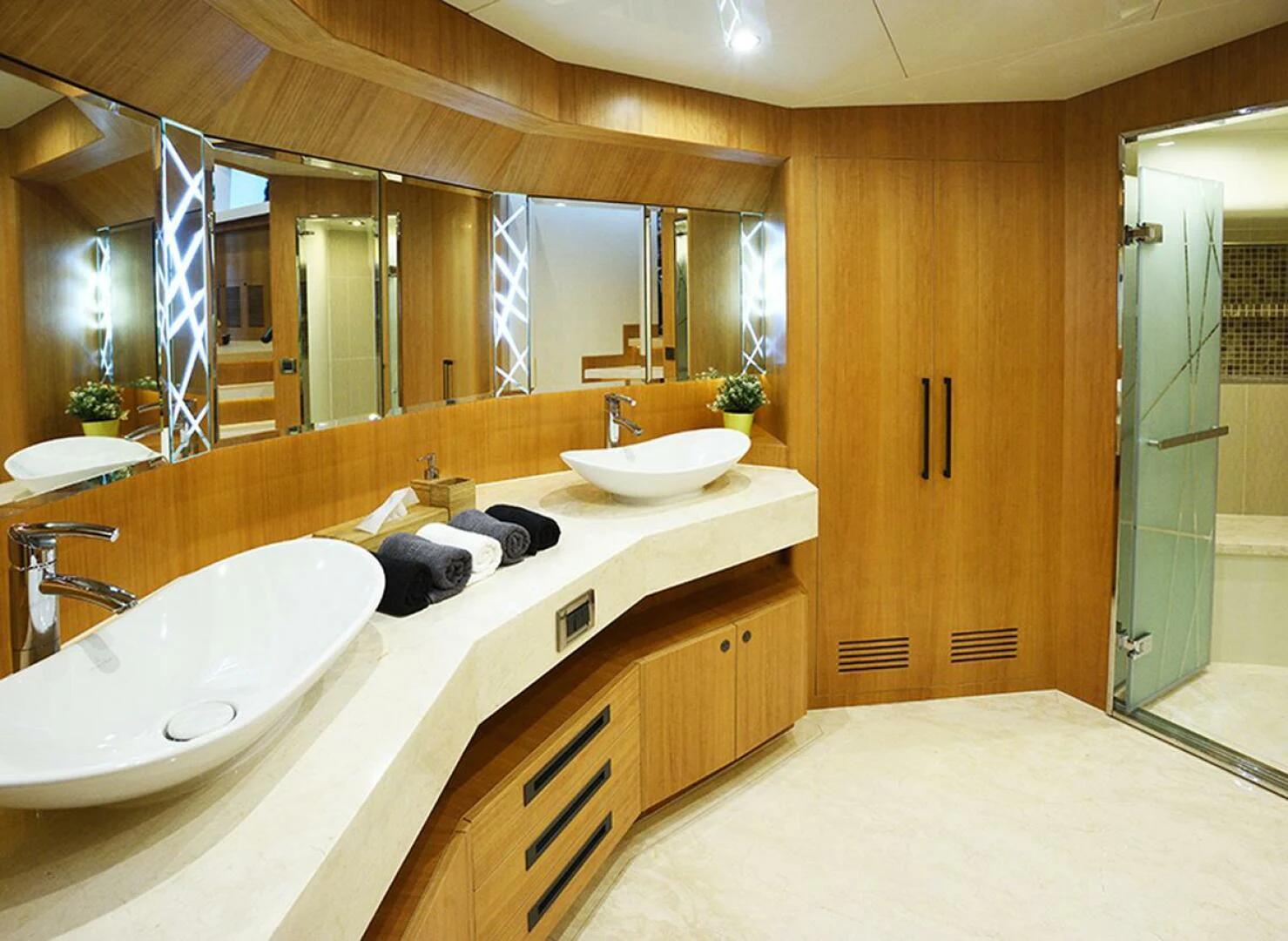 a bathroom with a large mirror aboard JOHNSON 93 OPEN FB Yacht for Sale