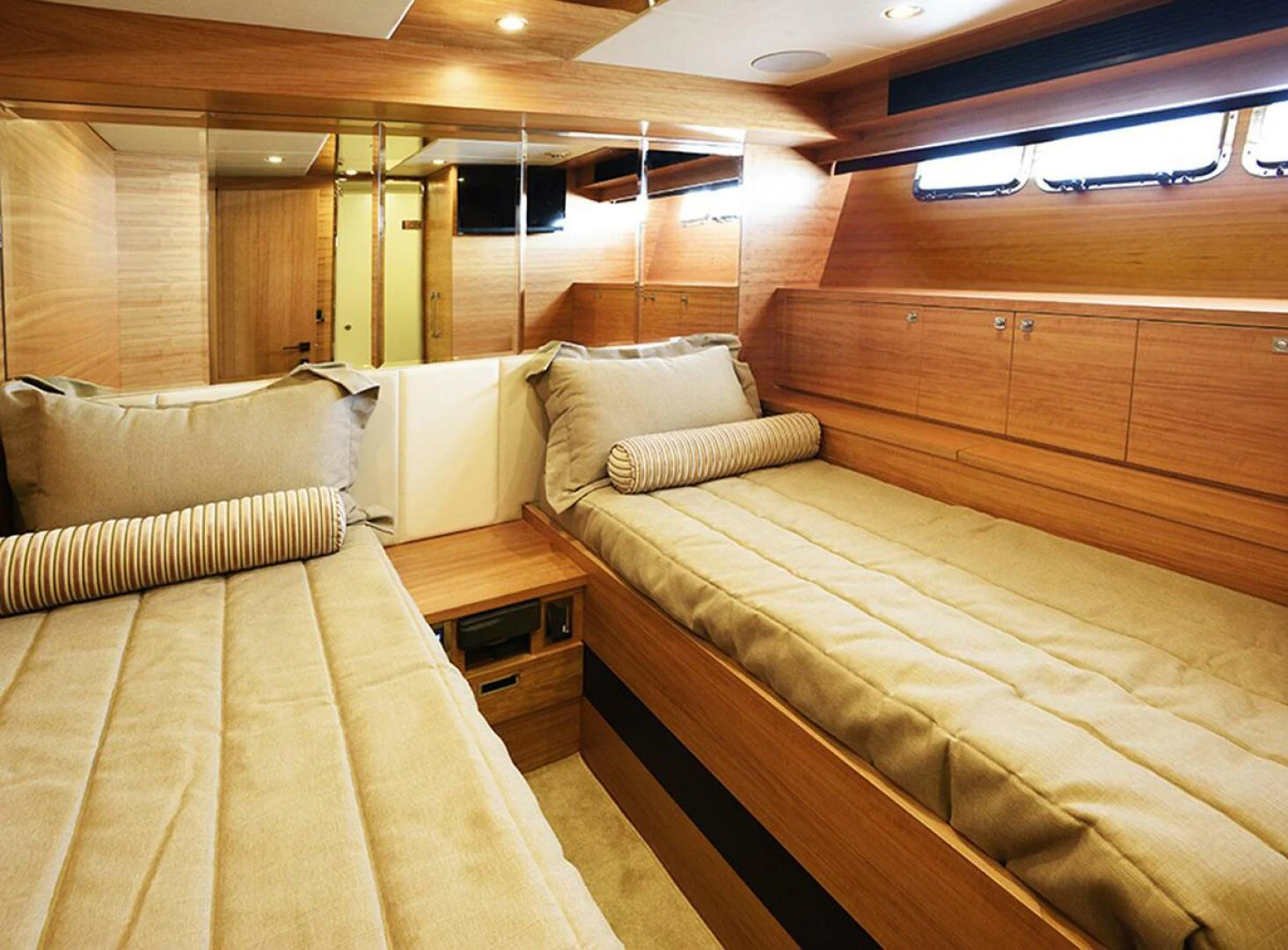 a room with a bed and a wood wall aboard JOHNSON 93 OPEN FB Yacht for Sale