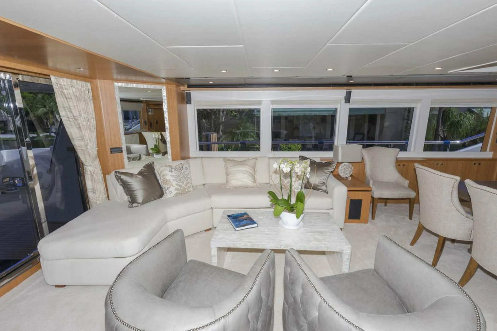 a living room with a table and chairs aboard JOHNSON 93 OPEN FB Yacht for Sale