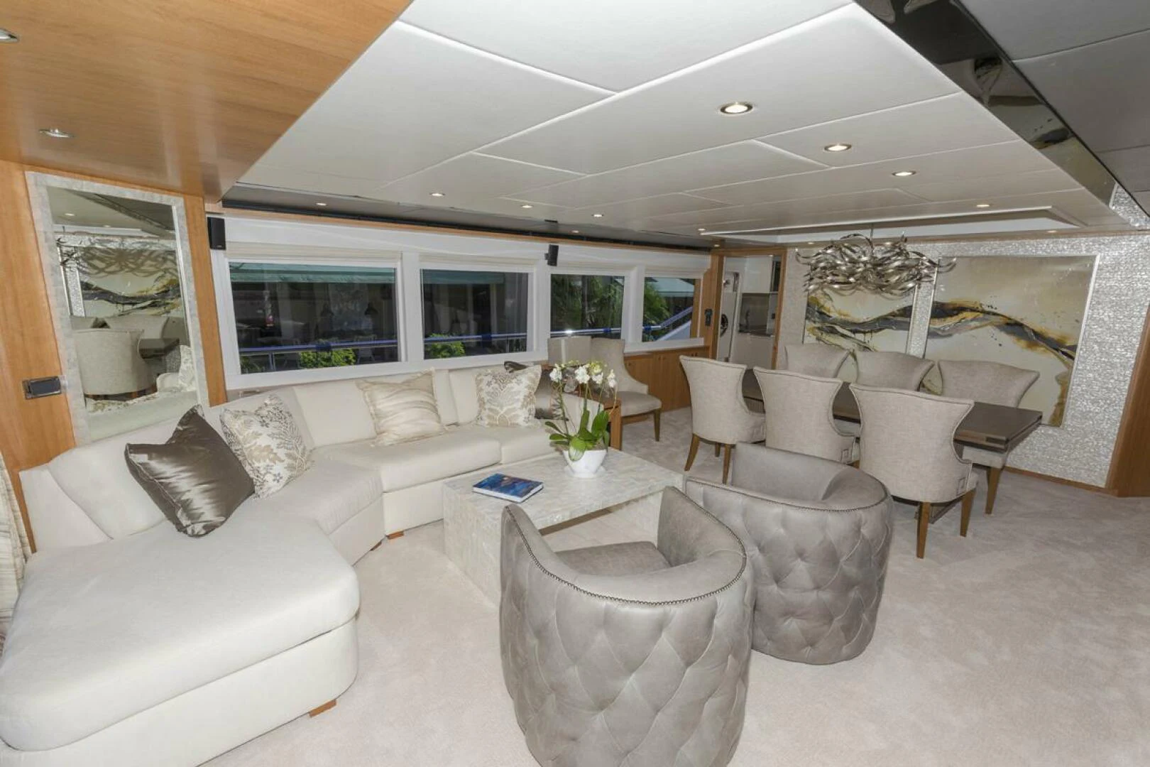 a living room with a large window aboard JOHNSON 93 OPEN FB Yacht for Sale