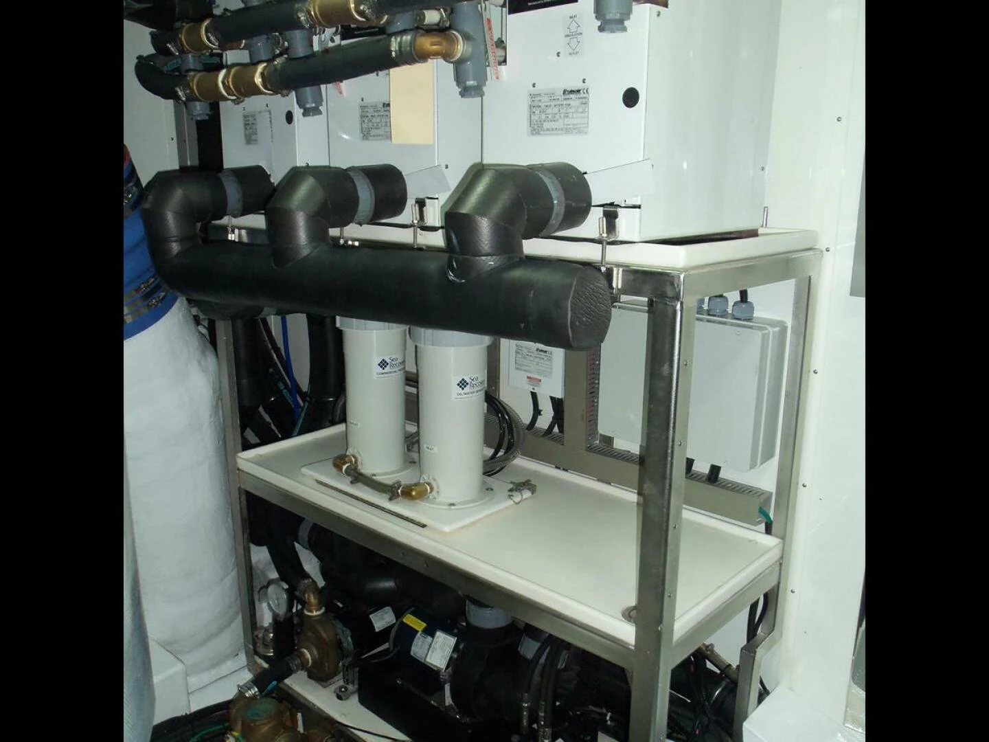 a machine with a large black pipe aboard JOHNSON 93 OPEN FB Yacht for Sale