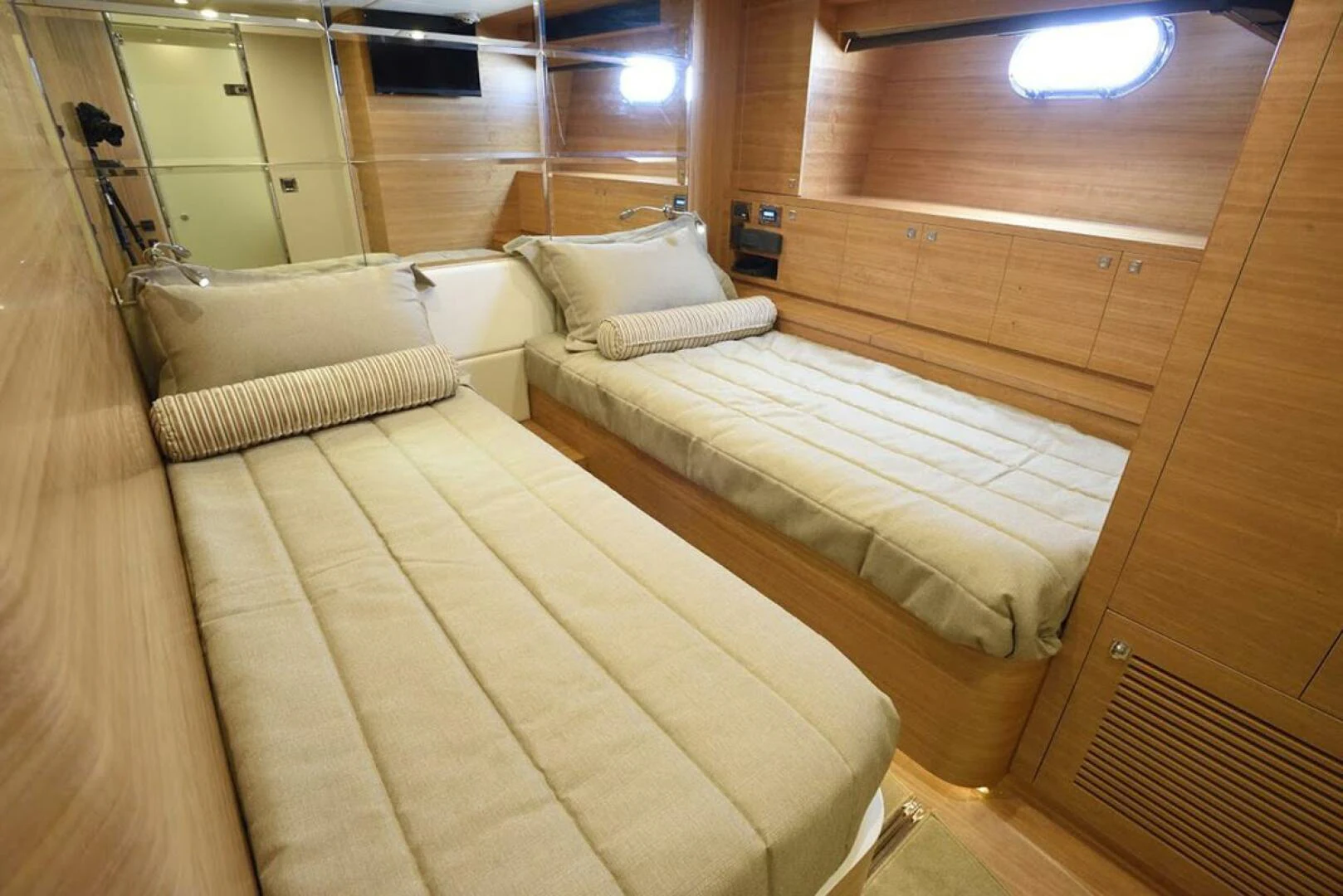 a room with beds in it aboard JOHNSON 93 OPEN FB Yacht for Sale