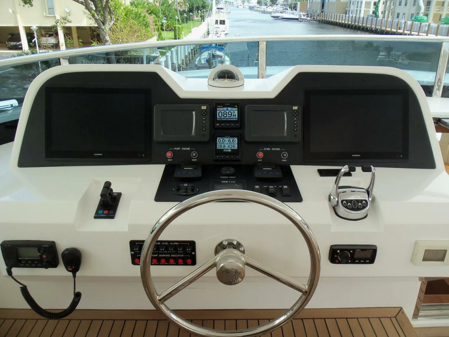 a console with a screen and buttons aboard JOHNSON 93 OPEN FB Yacht for Sale