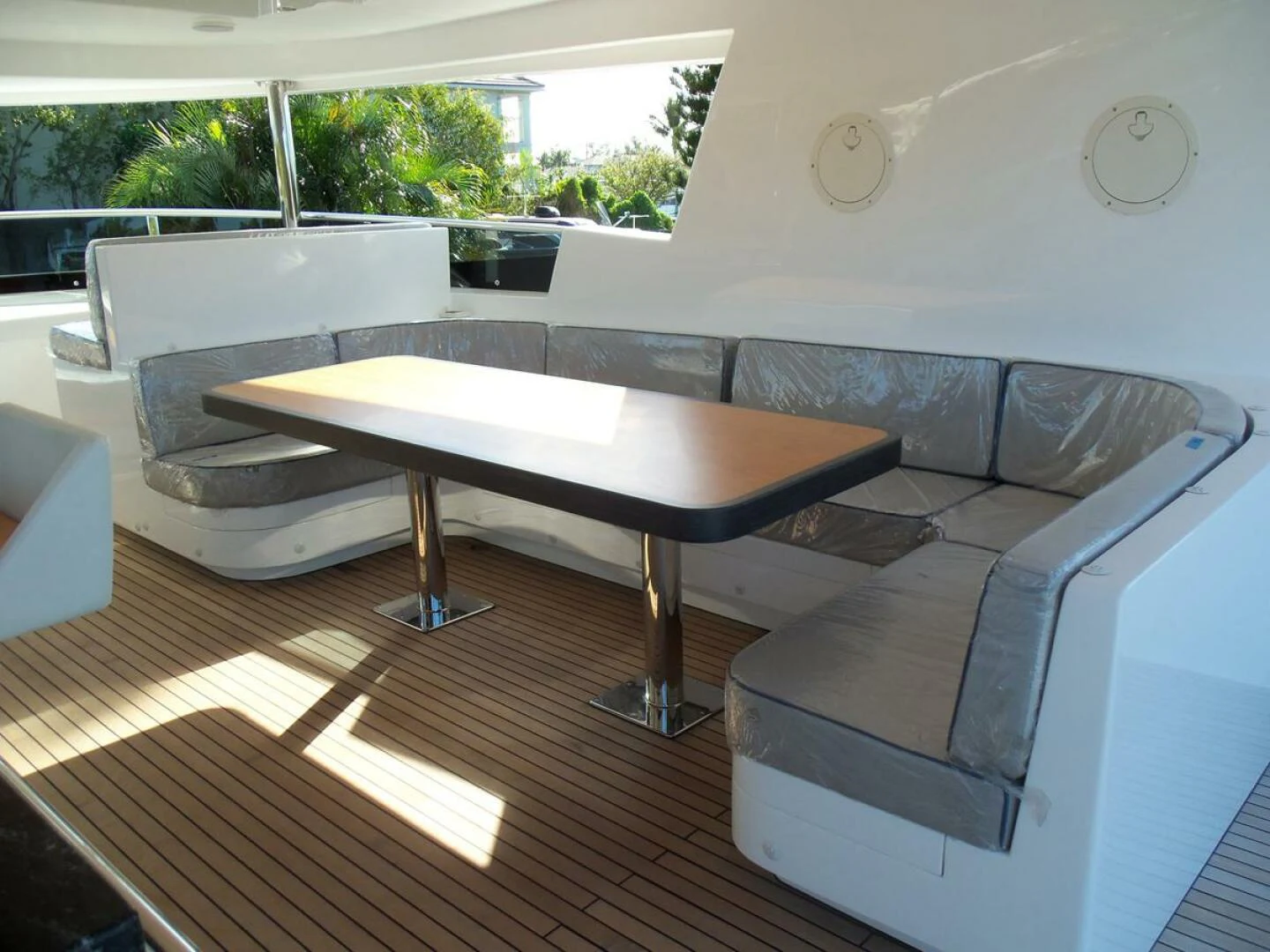 a room with a couch and a table aboard JOHNSON 93 OPEN FB Yacht for Sale