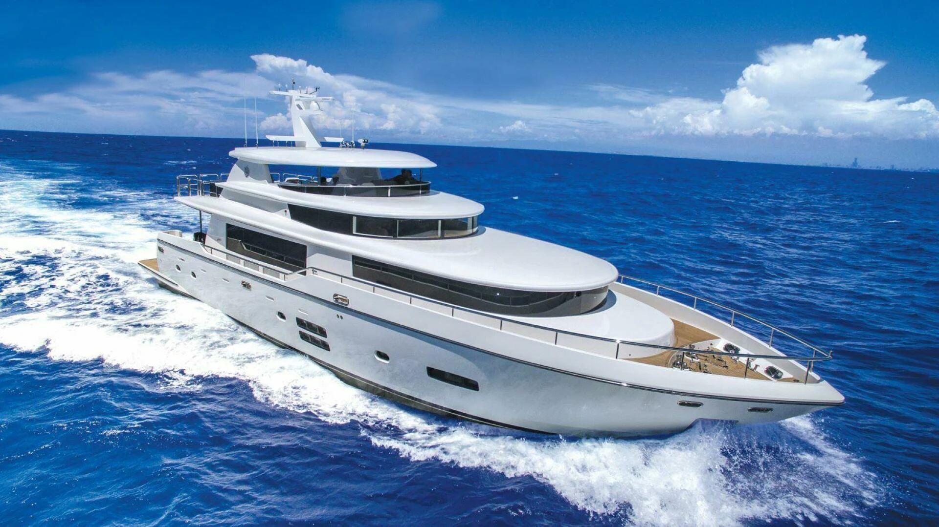 a white yacht on the water aboard JOHNSON 93 OPEN FB Yacht for Sale