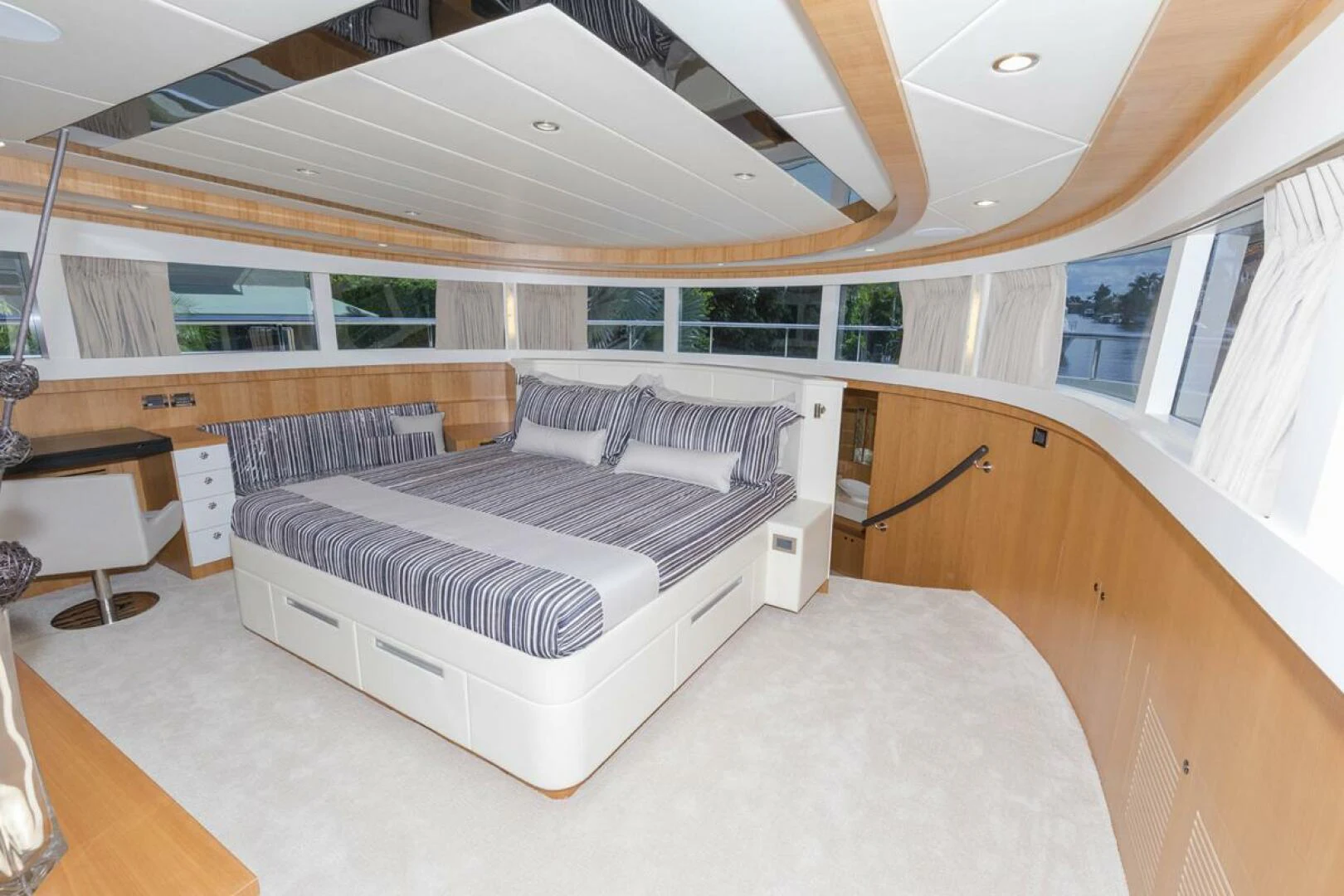 a large room with a bed and a couch aboard JOHNSON 93 OPEN FB Yacht for Sale