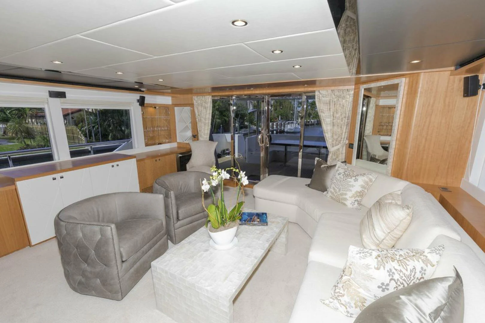 a living room with a large window aboard JOHNSON 93 OPEN FB Yacht for Sale