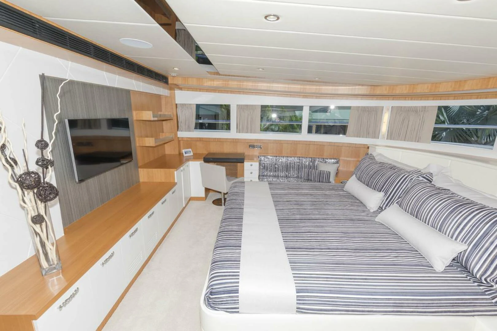 a room with a bed and a tv aboard JOHNSON 93 OPEN FB Yacht for Sale
