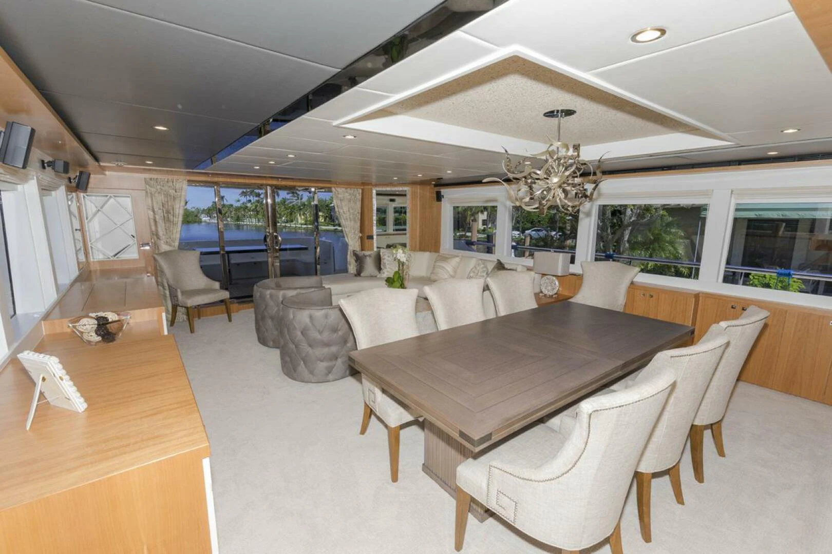 a large room with tables and chairs aboard JOHNSON 93 OPEN FB Yacht for Sale