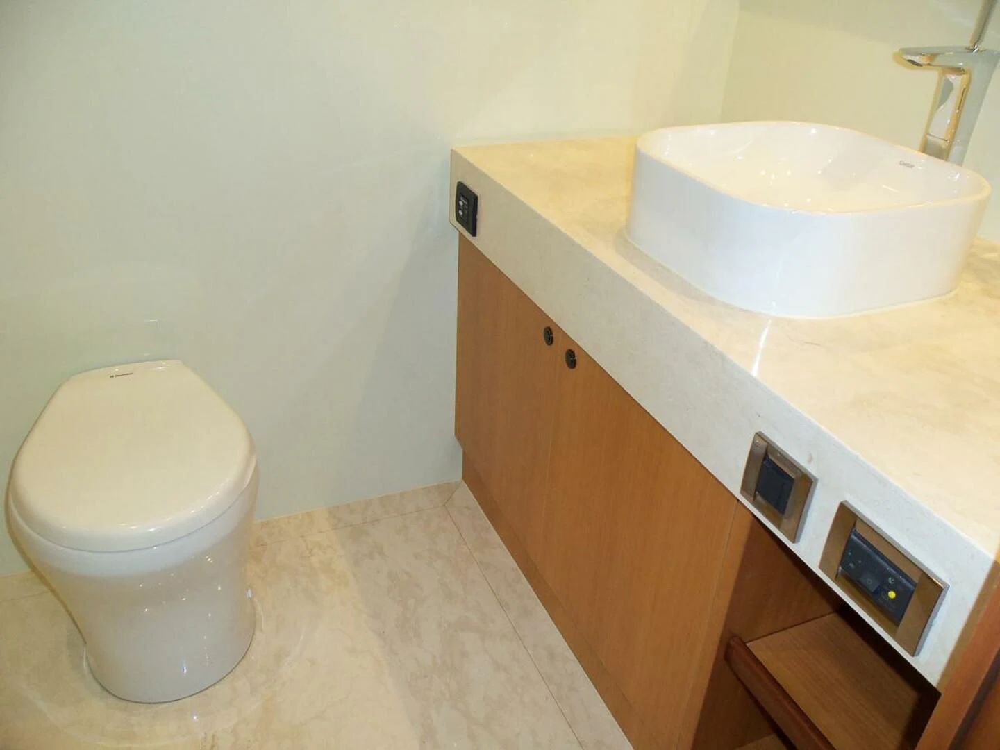 a bathroom with a sink and a toilet aboard JOHNSON 93 OPEN FB Yacht for Sale