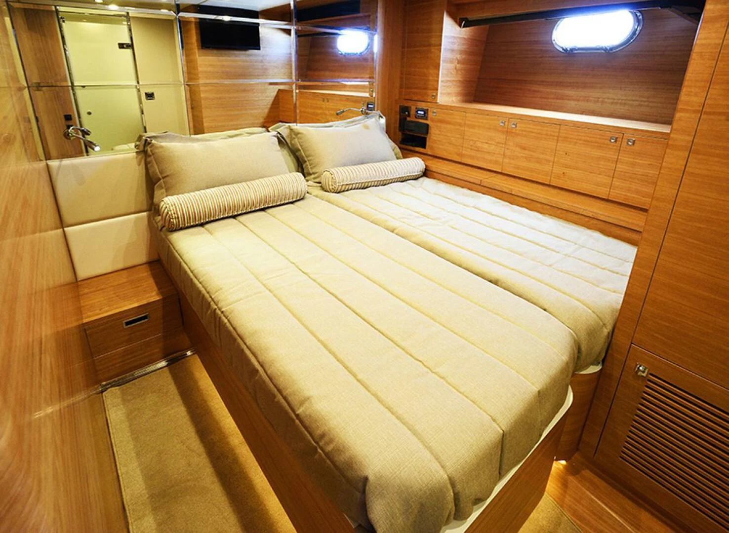 a bed in a room aboard JOHNSON 93 OPEN FB Yacht for Sale