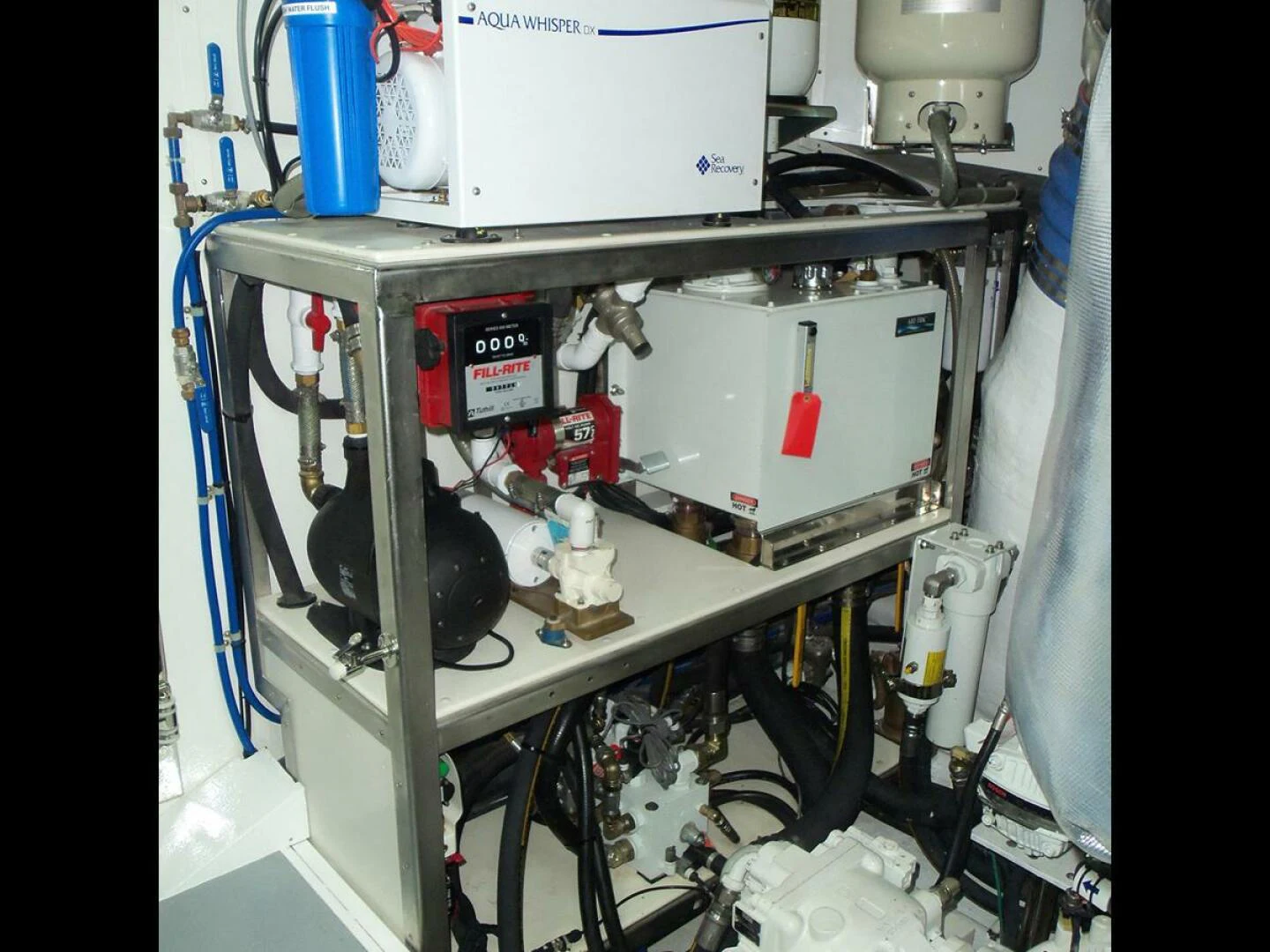 a white machine with a black lid aboard JOHNSON 93 OPEN FB Yacht for Sale