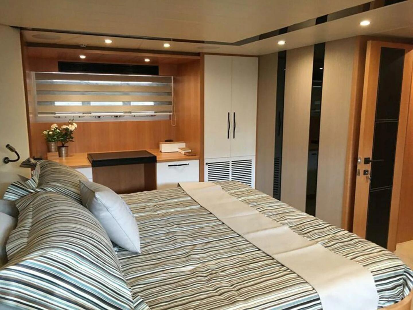 a bed in a room aboard JOHNSON 93 OPEN FB Yacht for Sale