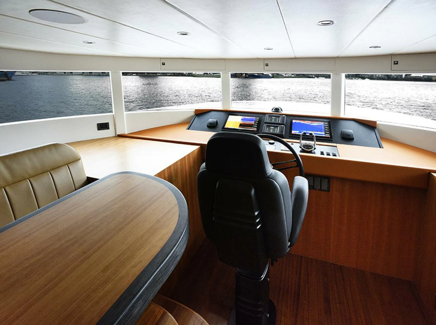 a room with a desk and chairs aboard JOHNSON 93 OPEN FB Yacht for Sale
