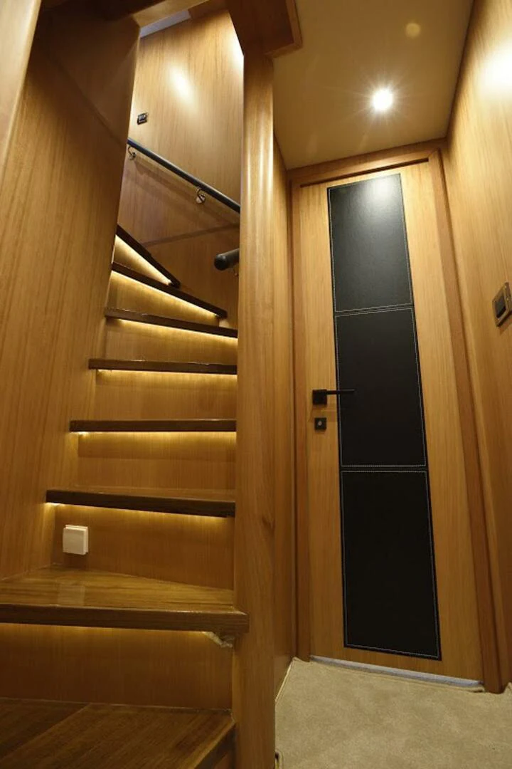 a wooden door with a black door aboard JOHNSON 93 OPEN FB Yacht for Sale