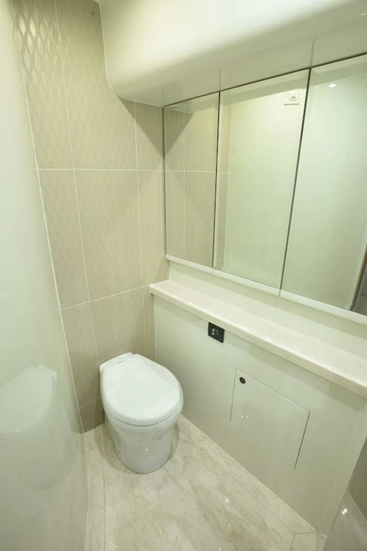 a bathroom with a toilet aboard JOHNSON 93 OPEN FB Yacht for Sale