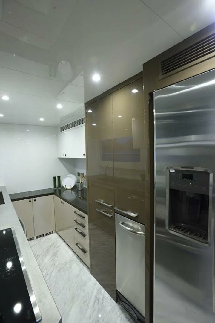 a kitchen with a large glass door aboard JOHNSON 93 OPEN FB Yacht for Sale