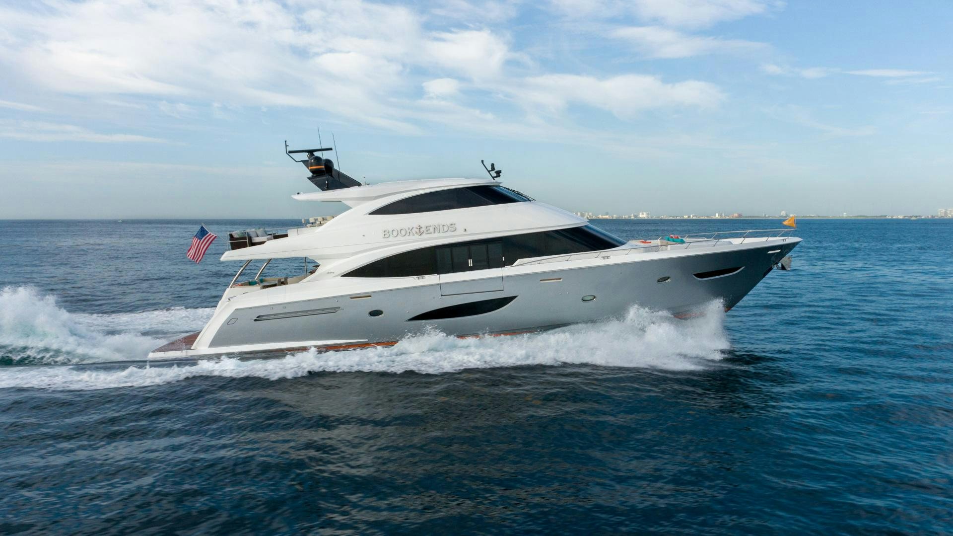 a white yacht on the water aboard BOOK ENDS Yacht for Sale