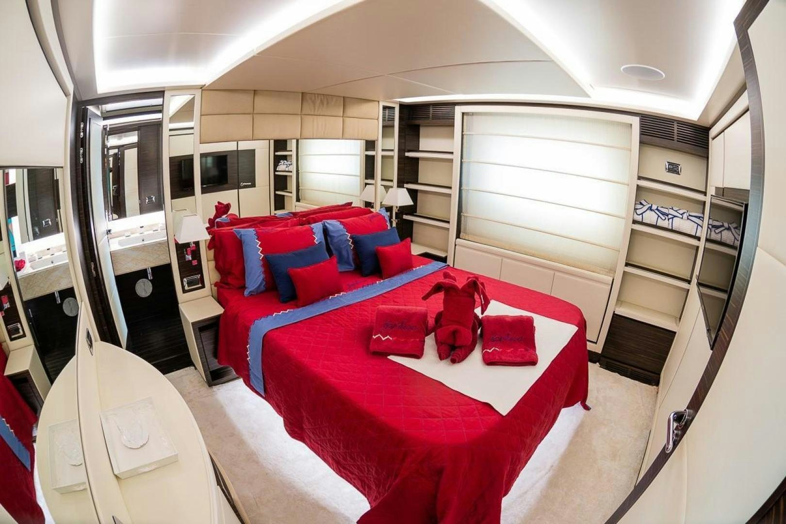 a bedroom with red pillows aboard ZAPHIRA Yacht for Sale