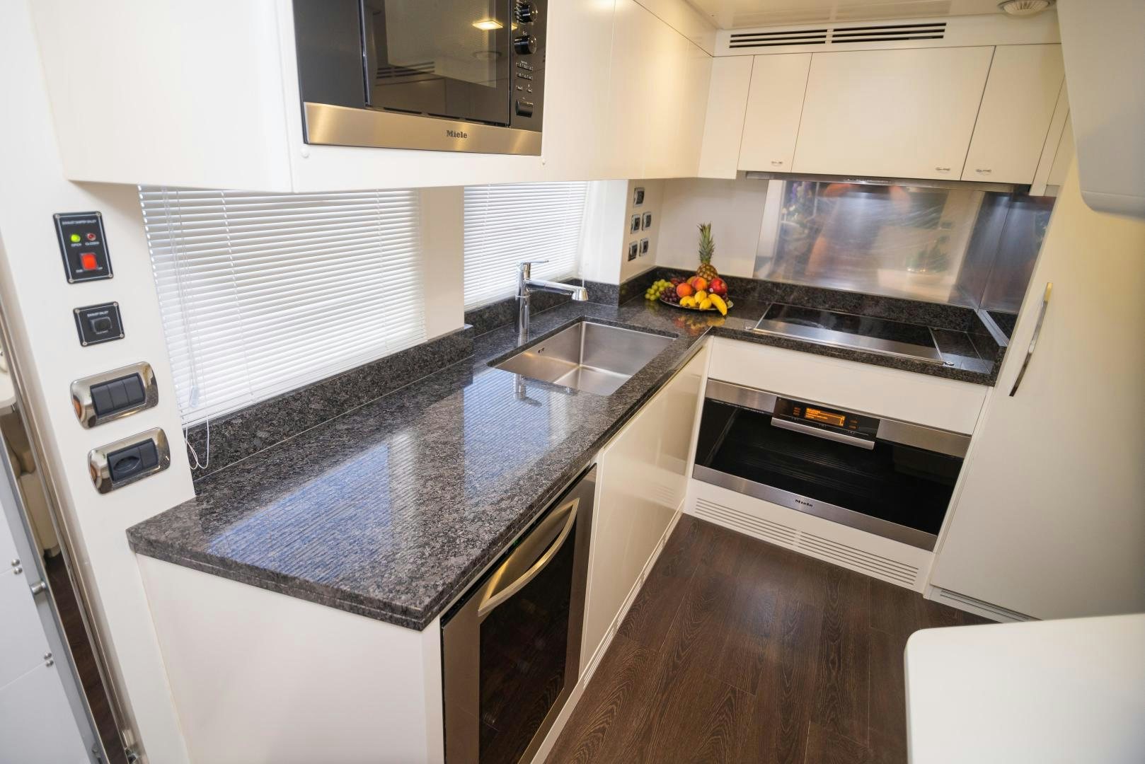 a kitchen with a stove and oven aboard ZAPHIRA Yacht for Sale