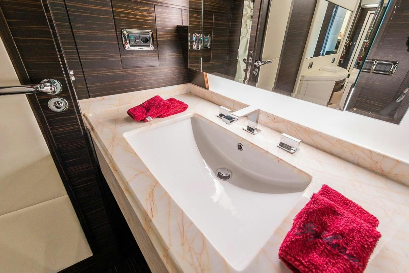 a bathroom with a sink and a mirror aboard ZAPHIRA Yacht for Sale