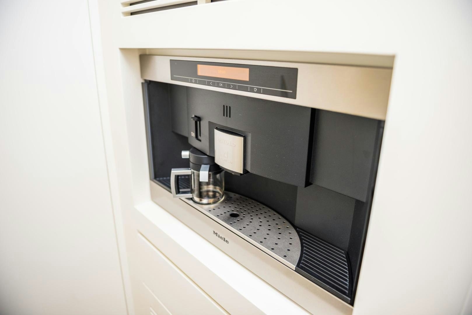 a kitchen with a stove and a vent aboard ZAPHIRA Yacht for Sale