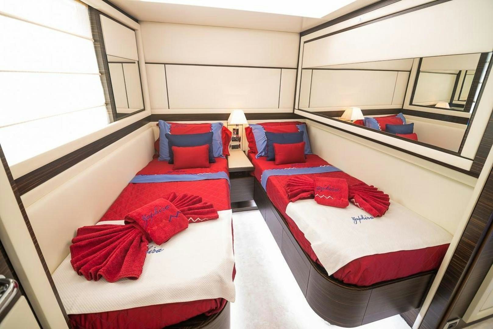 a room with beds and a couch aboard ZAPHIRA Yacht for Sale