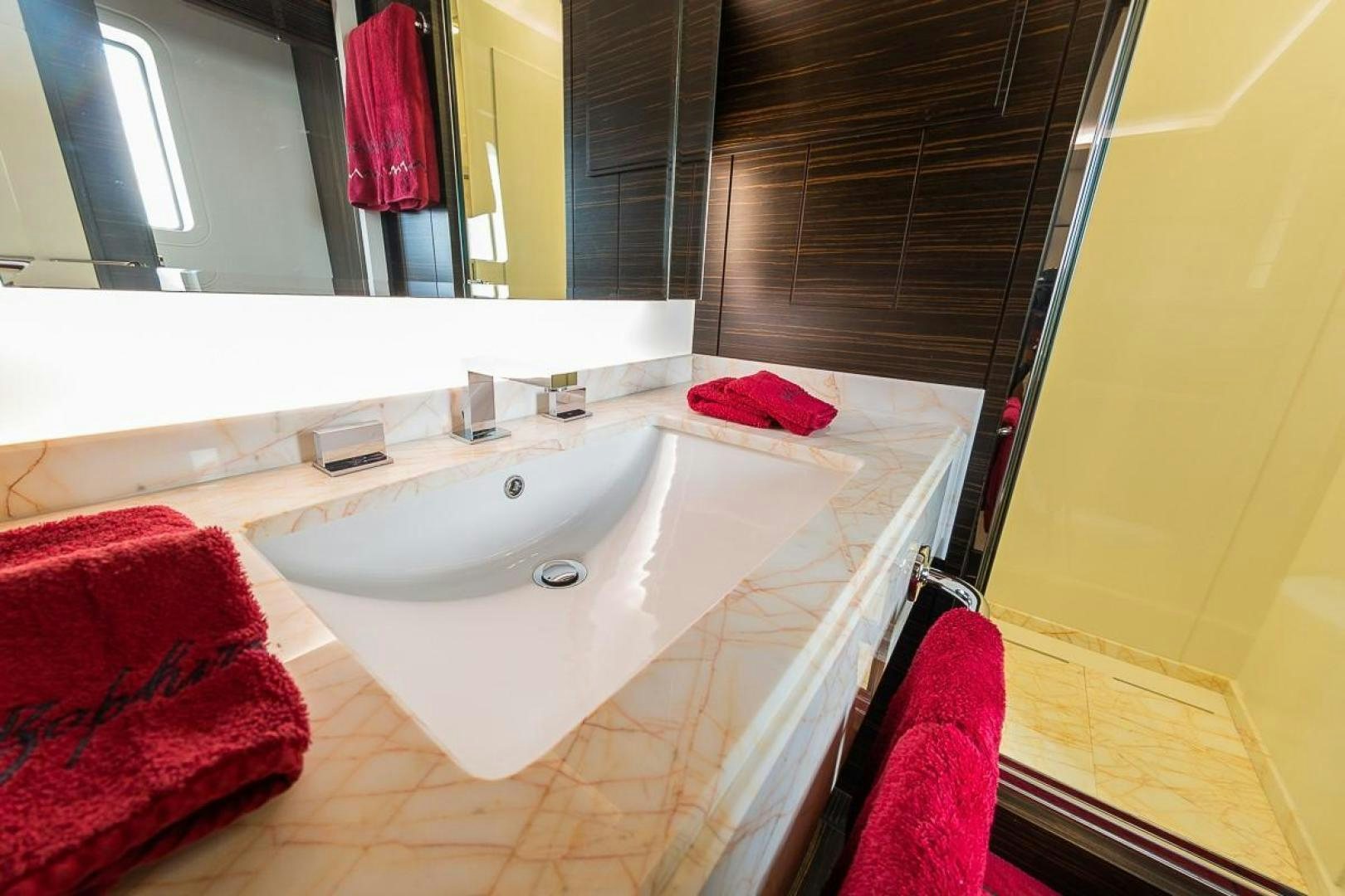 a bathroom with a sink and a mirror aboard ZAPHIRA Yacht for Sale