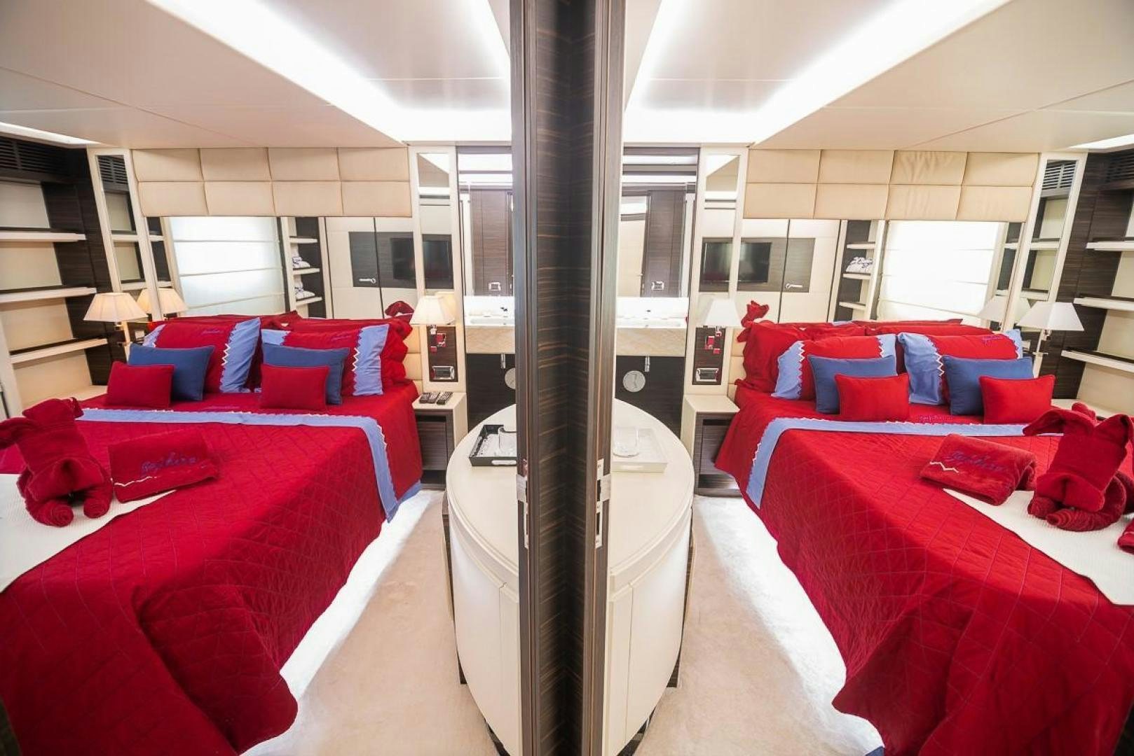 a room with red beds and red beds aboard ZAPHIRA Yacht for Sale