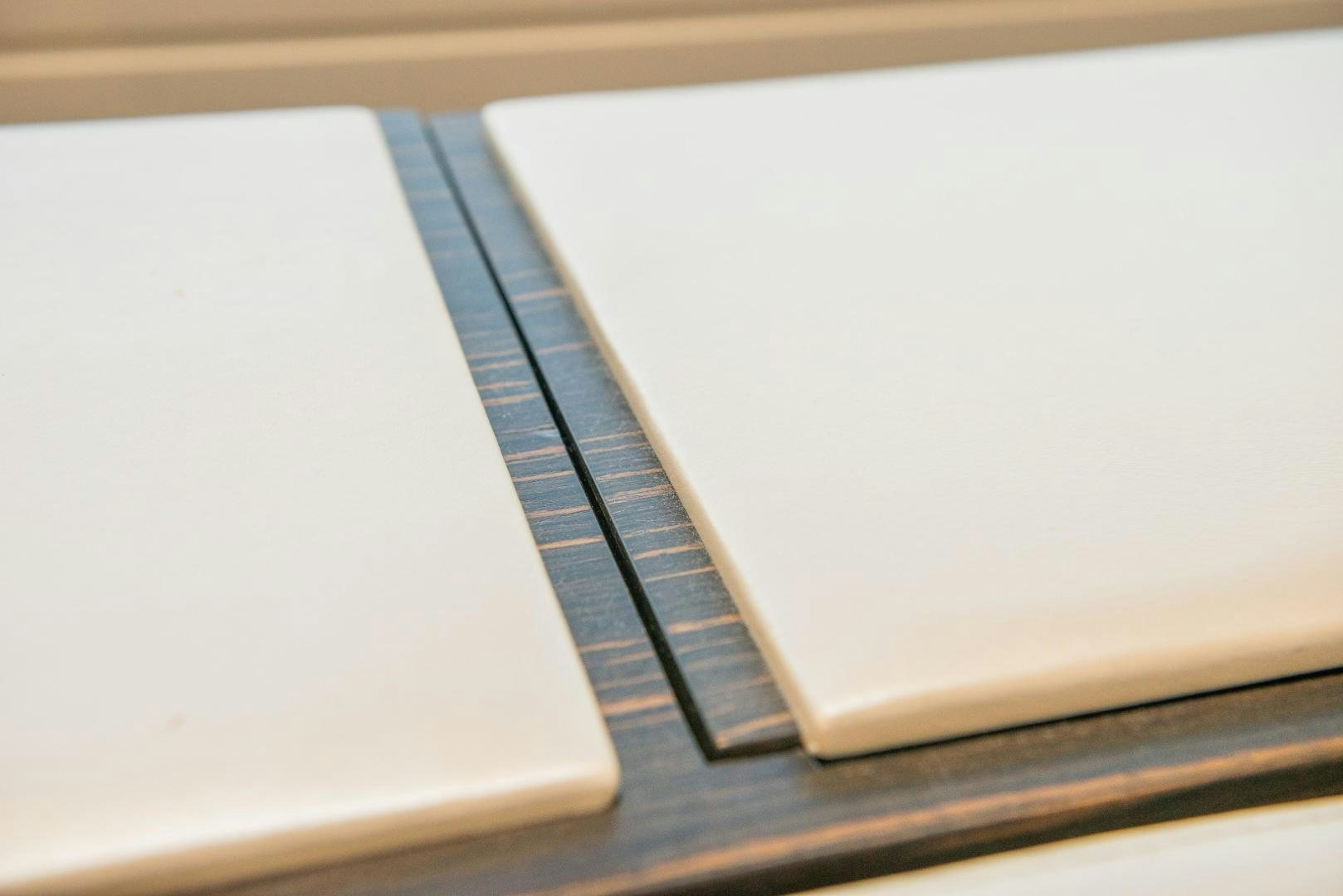 a notebook with a pen on it aboard ZAPHIRA Yacht for Sale