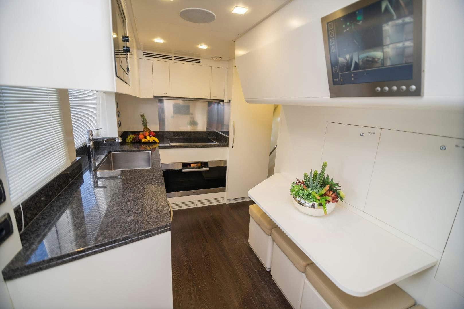 a kitchen with a large island aboard ZAPHIRA Yacht for Sale