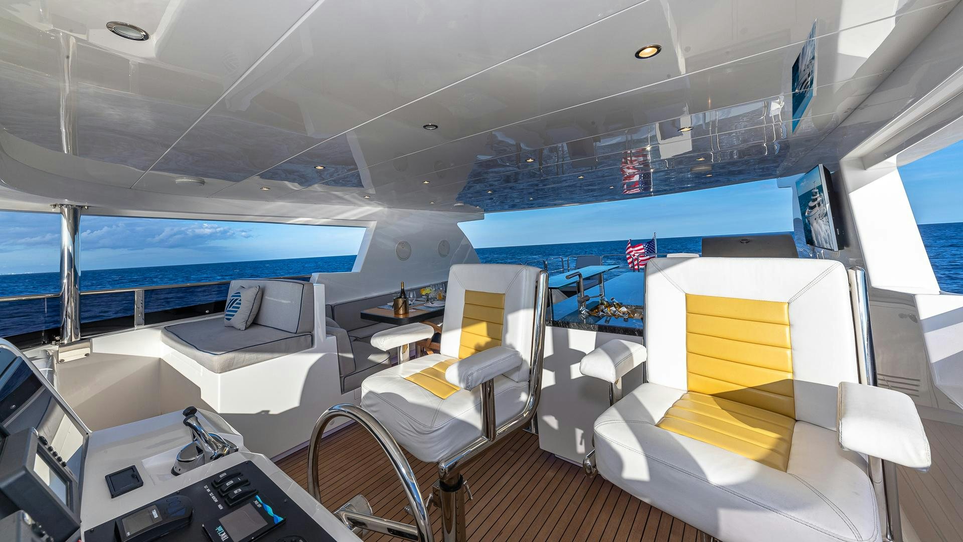 inside of a room with a large window and a view of the ocean aboard LIFE FOR SALE Yacht for Sale