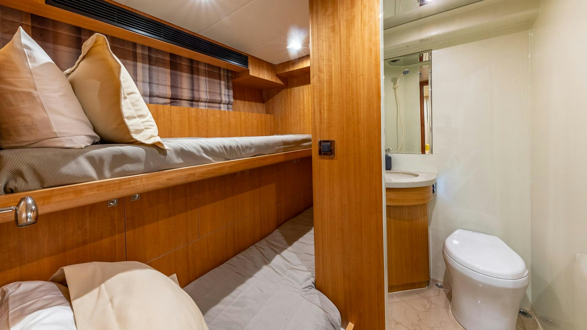 a bathroom with a bed and a bathtub aboard LIFE FOR SALE Yacht for Sale