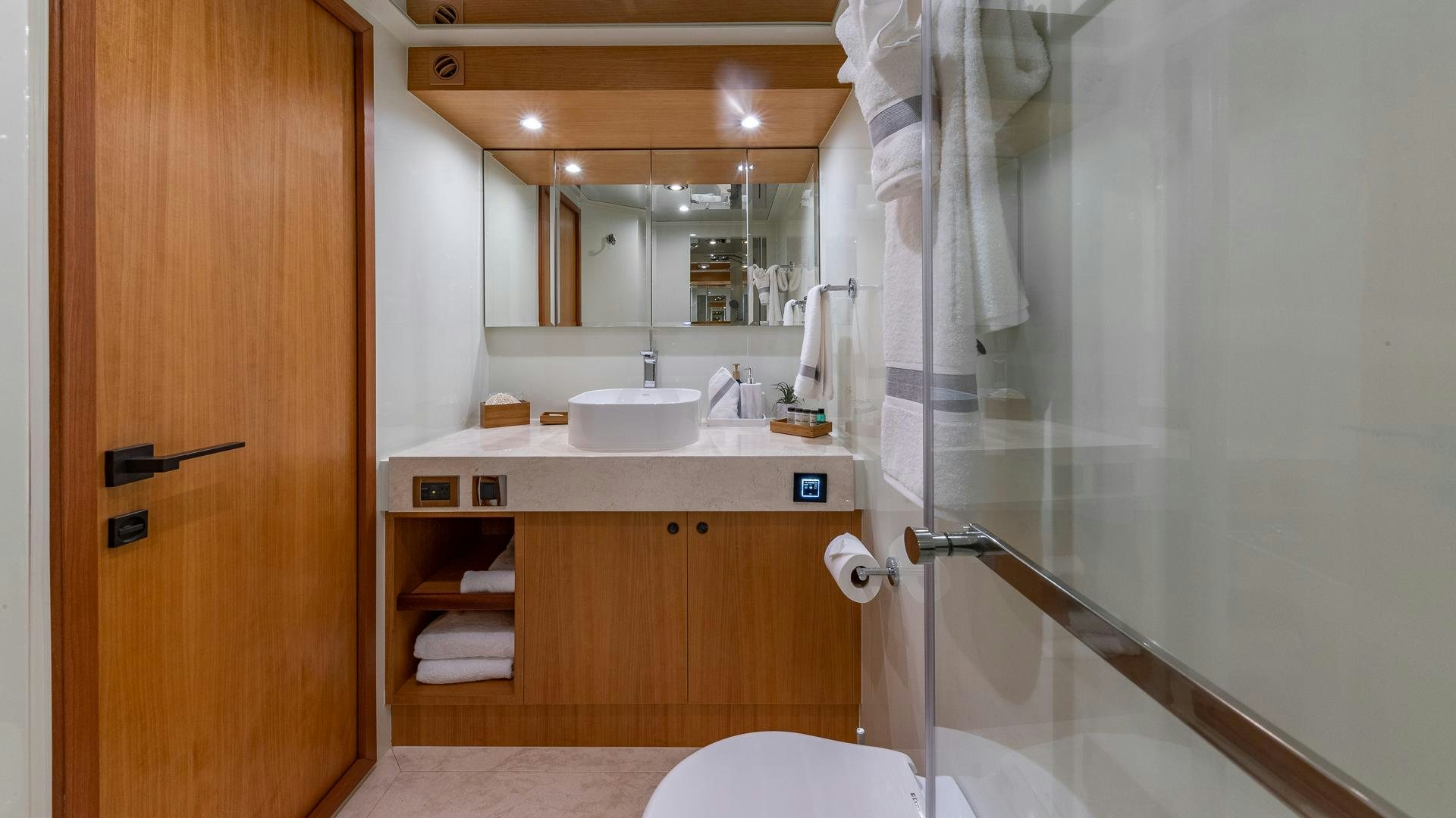 a bathroom with a glass shower aboard LIFE FOR SALE Yacht for Sale