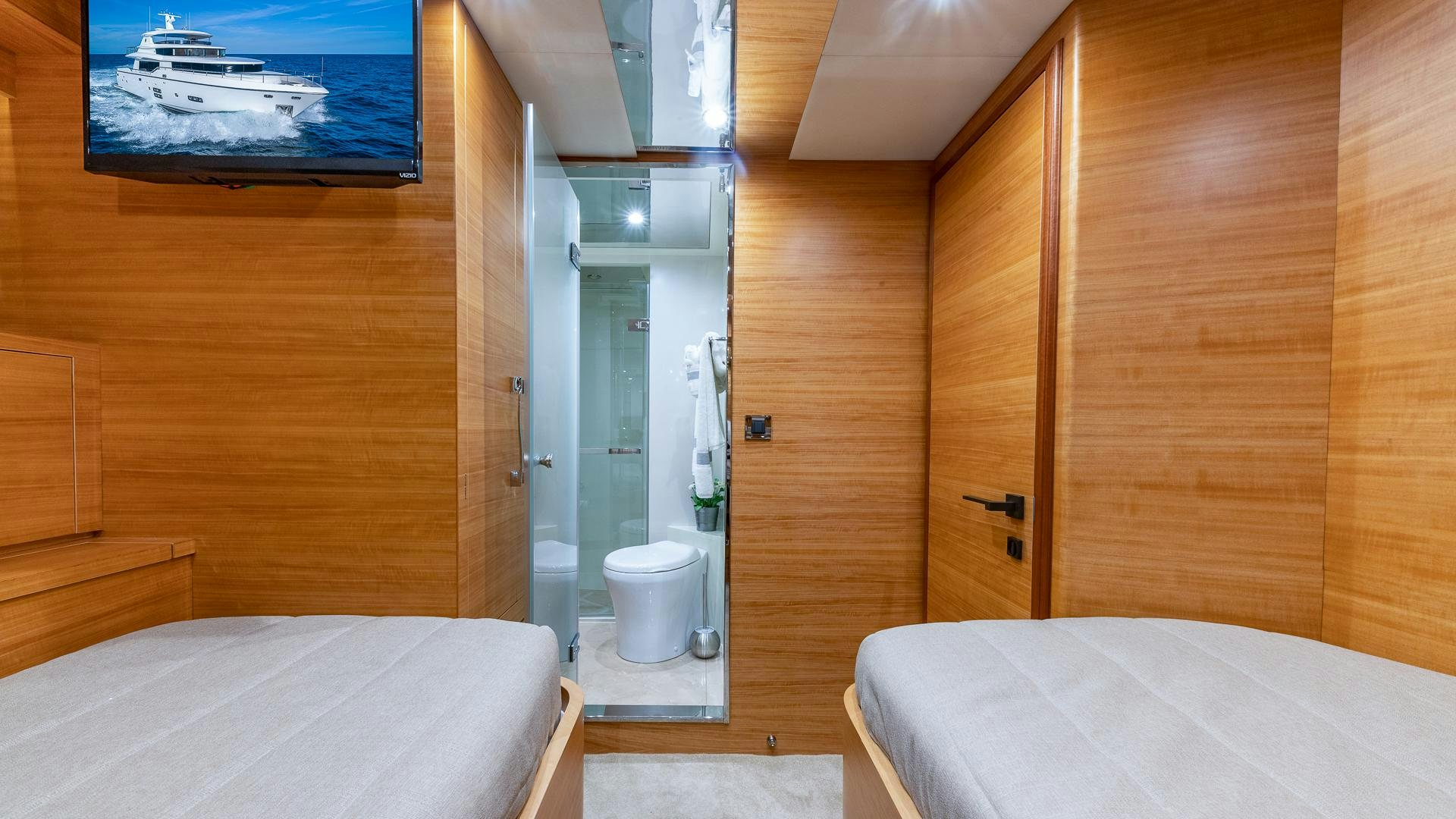 a room with a bed and a mirror aboard LIFE FOR SALE Yacht for Sale