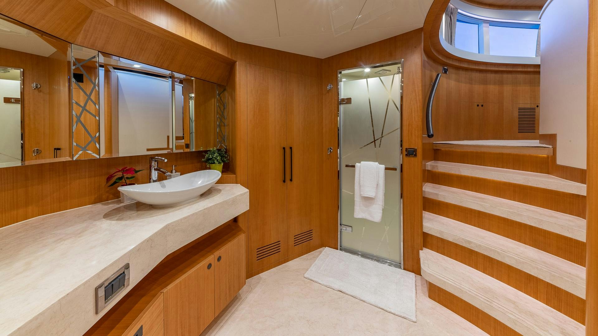 a bathroom with a sink and a mirror aboard LIFE FOR SALE Yacht for Sale