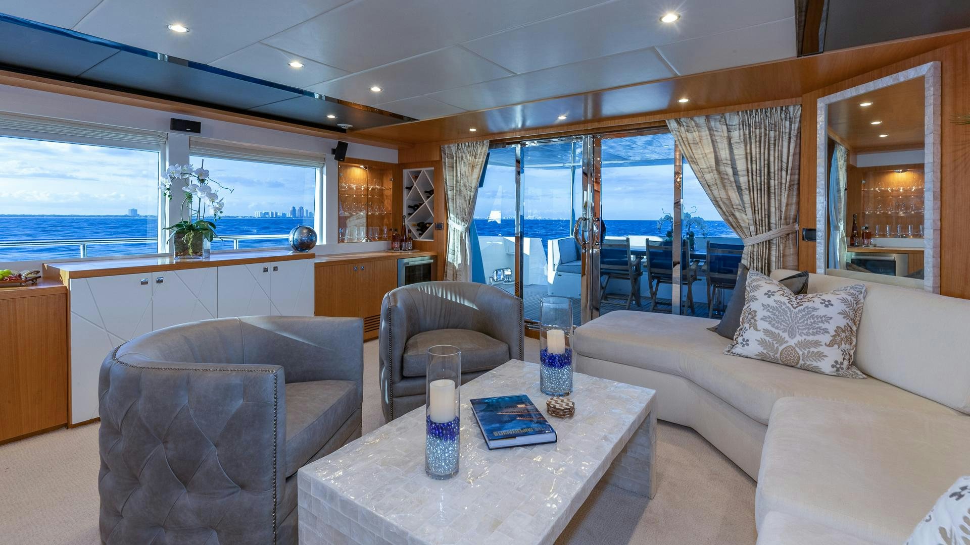 a living room with a large window aboard LIFE FOR SALE Yacht for Sale