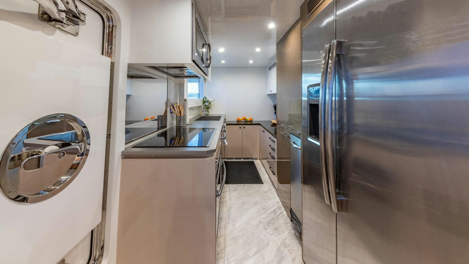 a kitchen with a large refrigerator aboard LIFE FOR SALE Yacht for Sale