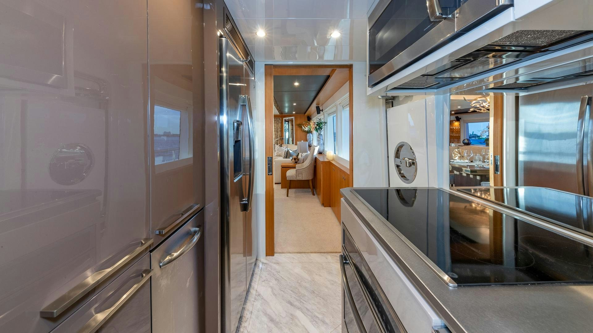 a hallway with glass doors aboard LIFE FOR SALE Yacht for Sale
