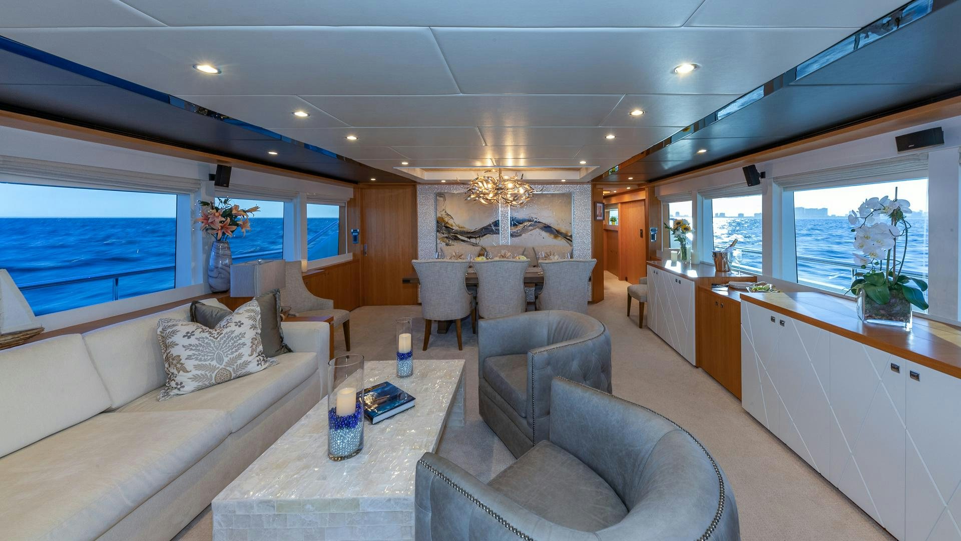a living room with a couch and a table aboard LIFE FOR SALE Yacht for Sale