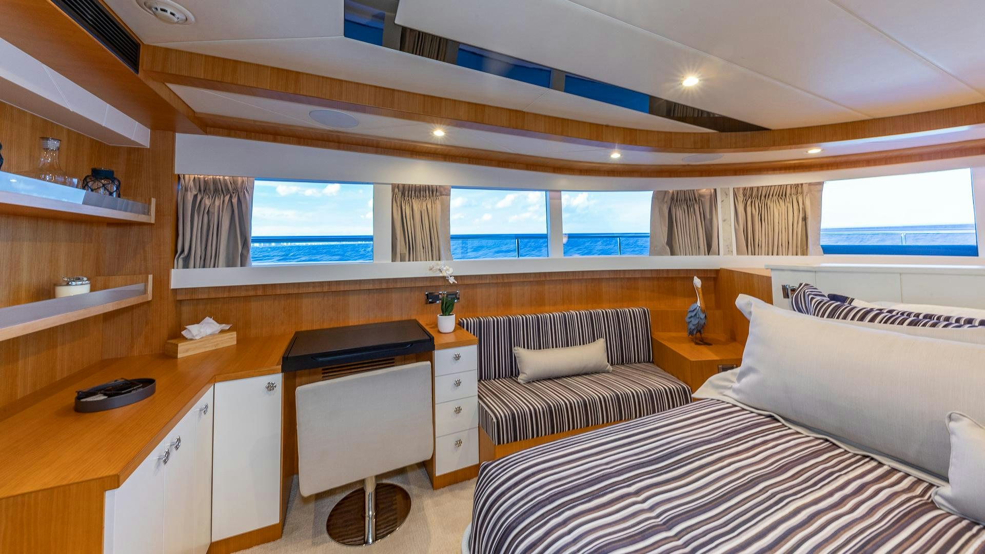 a room with a bed and desk aboard LIFE FOR SALE Yacht for Sale