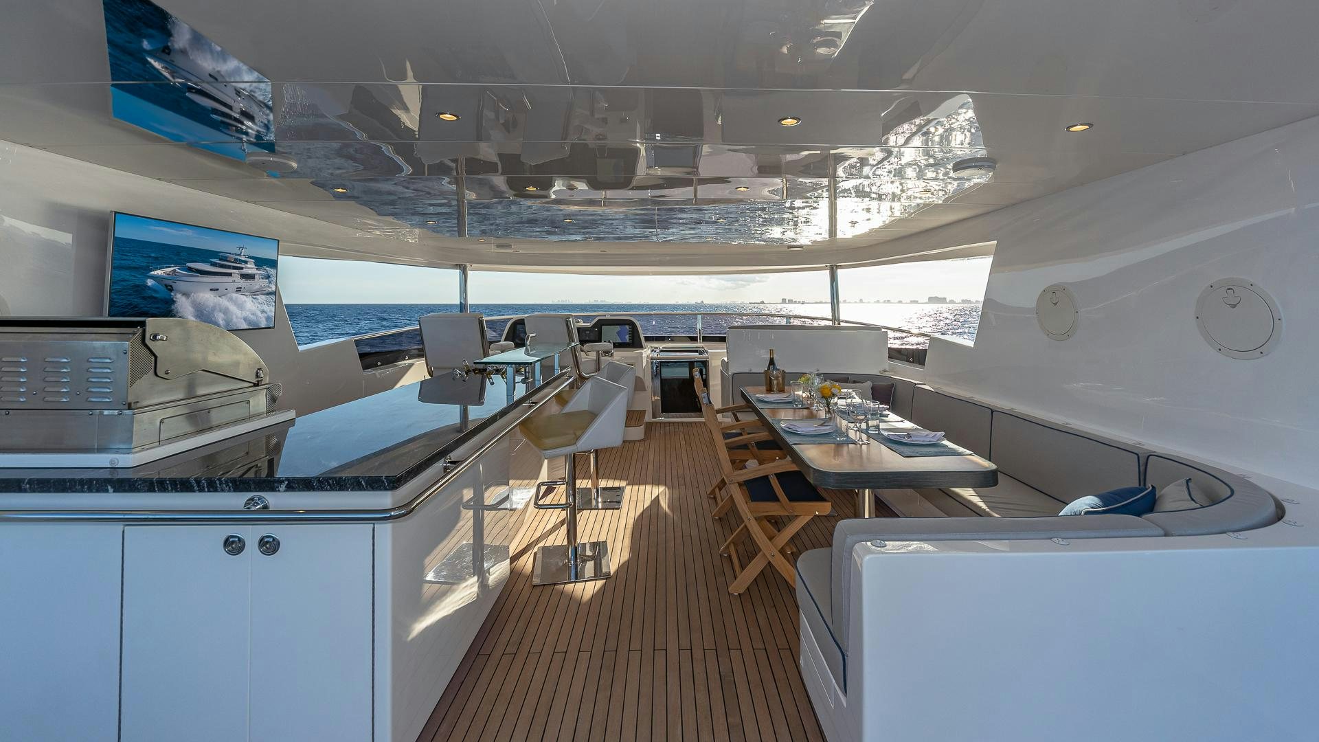a room with tables and chairs aboard LIFE FOR SALE Yacht for Sale